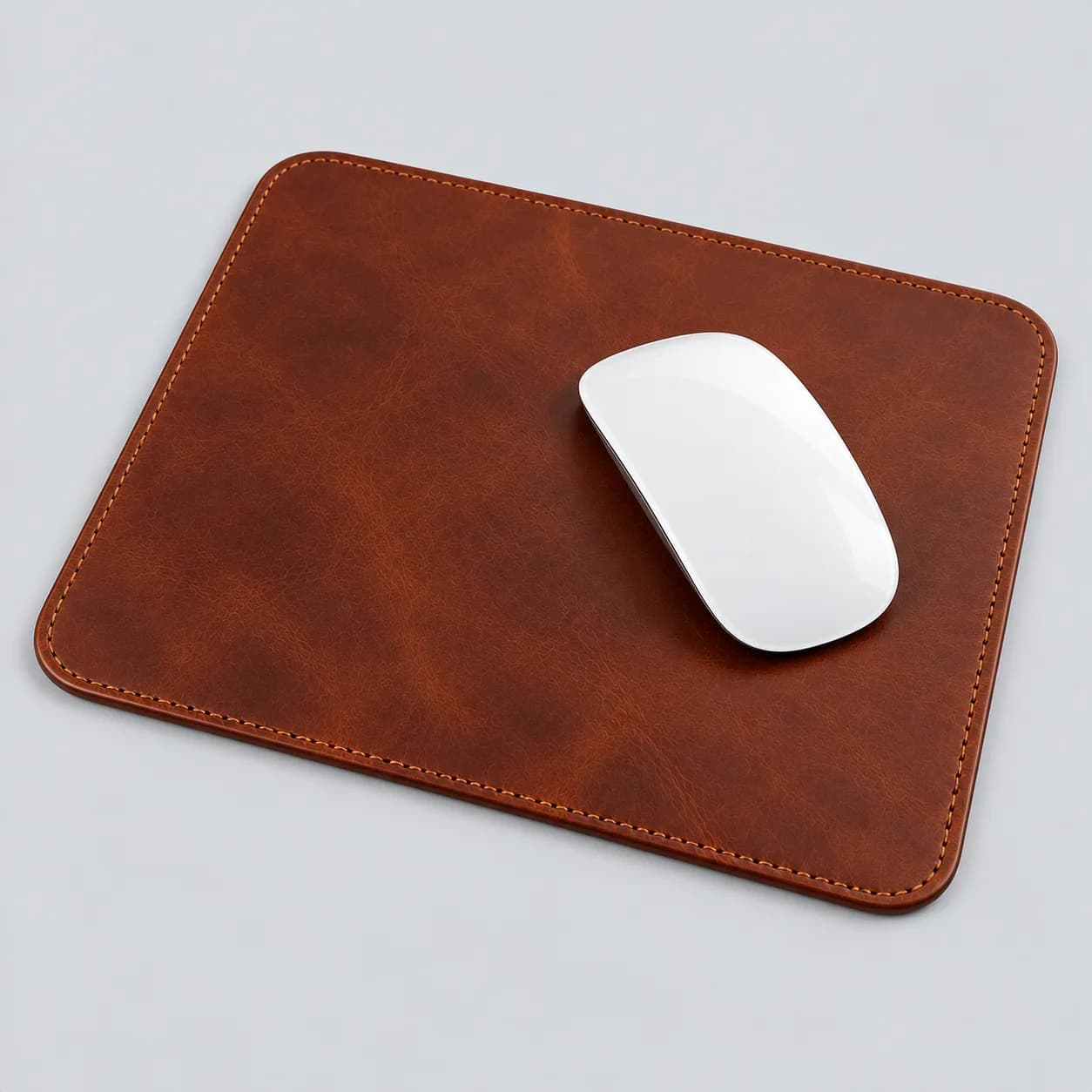 Leather mouse pad product direction on a neutral studio background