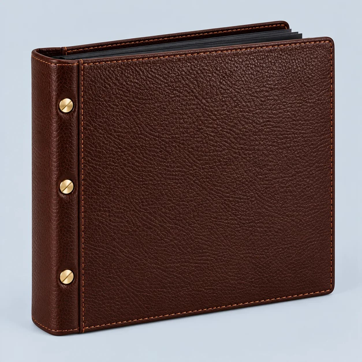Leather photo album product direction on a neutral studio background