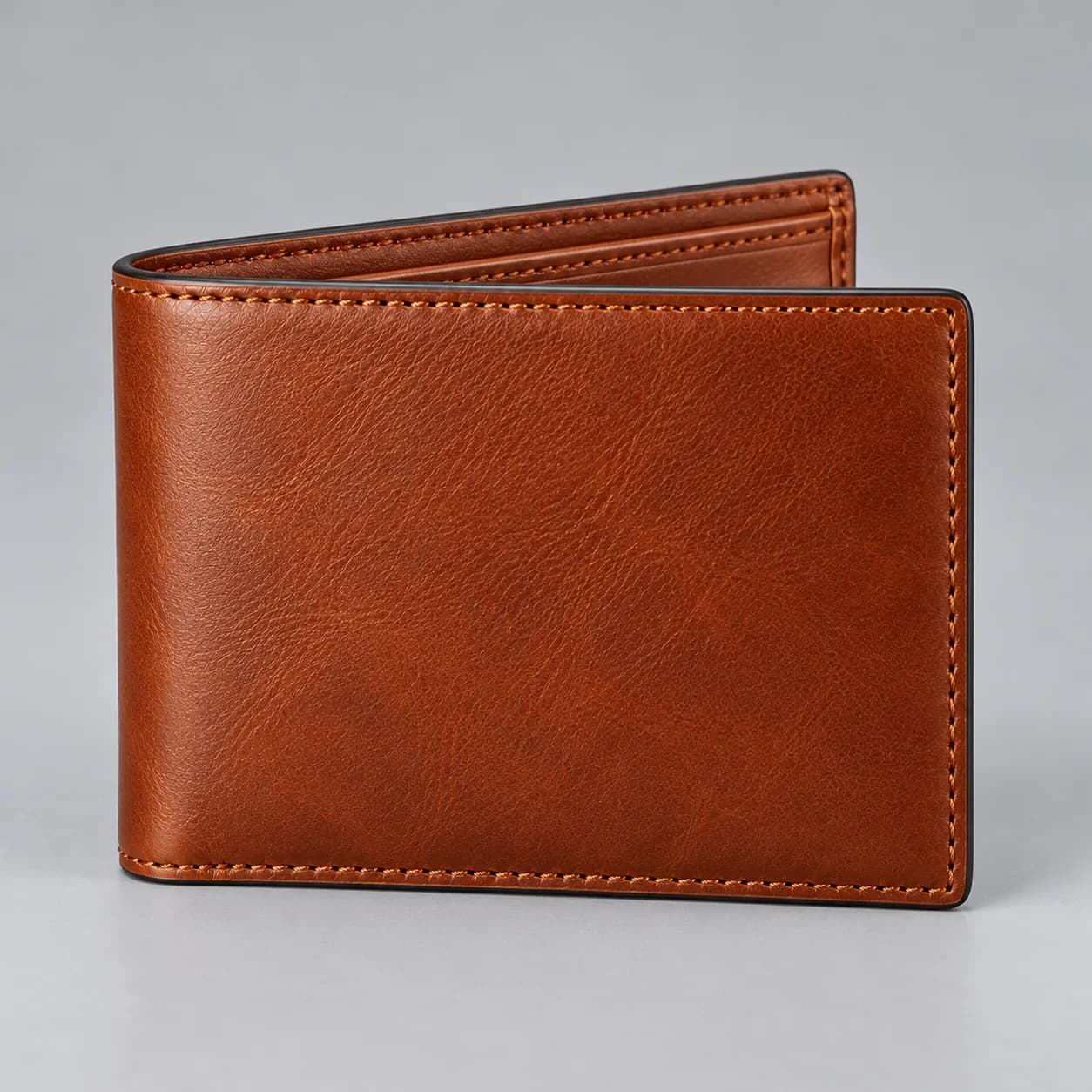 Leather bifold wallet main view on a neutral studio background