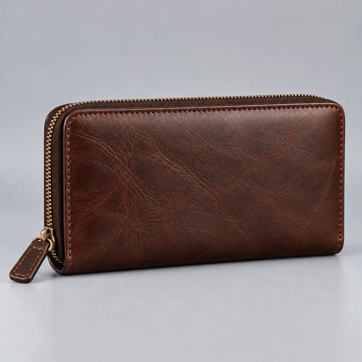 Leather zipper wallet product direction on a neutral studio background