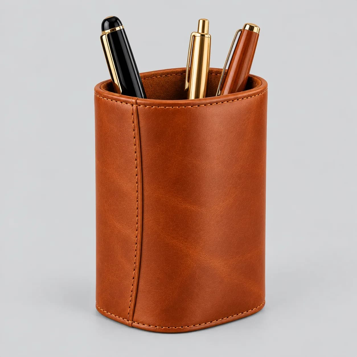 Leather pen holder product direction on a neutral studio background