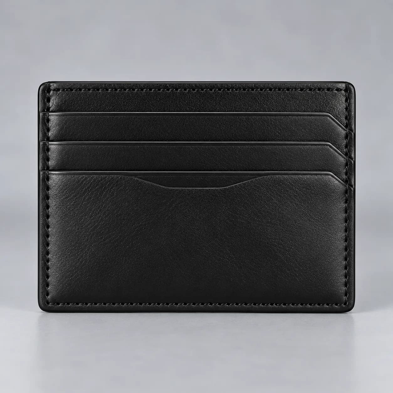 Leather card holder wallet product direction on a neutral studio background