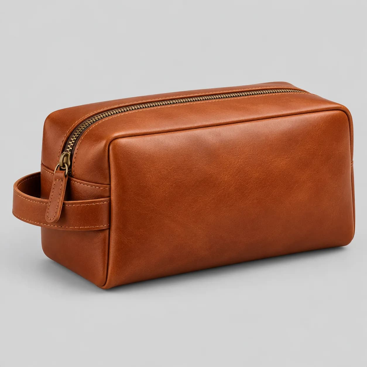 Leather toiletry bag product direction on a neutral studio background