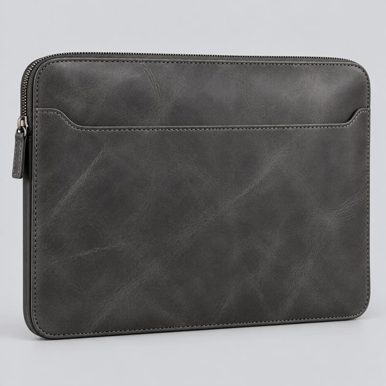 Leather laptop sleeve product direction on a neutral studio background