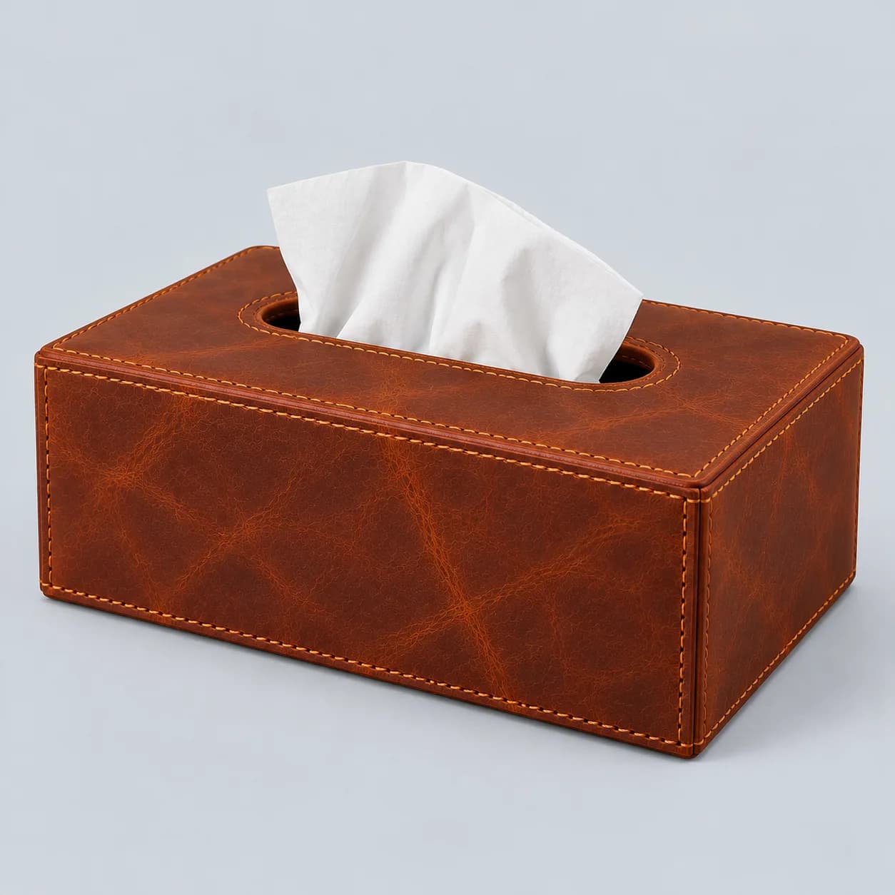 Leather tissue box product direction on a neutral studio background