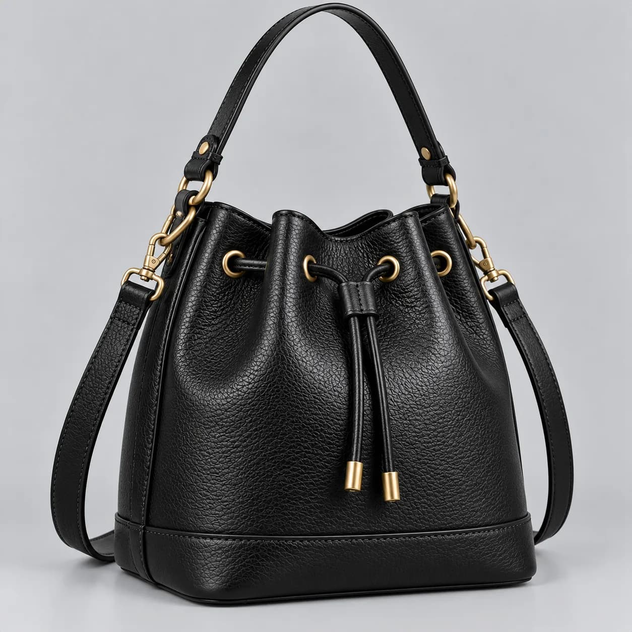 Leather bucket bag product direction on a neutral studio background