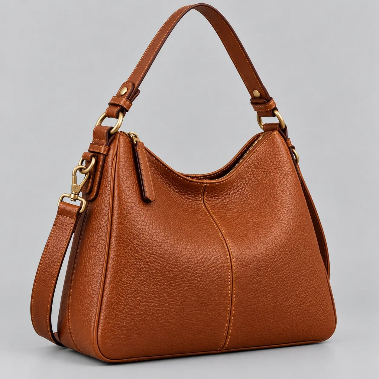 Leather shoulder bag product direction on a neutral studio background