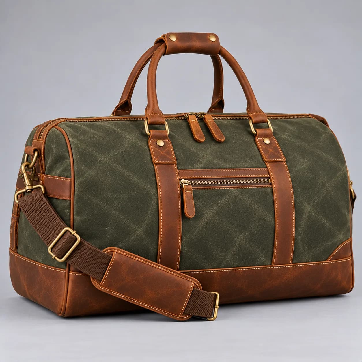 Waxed canvas and leather duffle bag product direction on a neutral studio background
