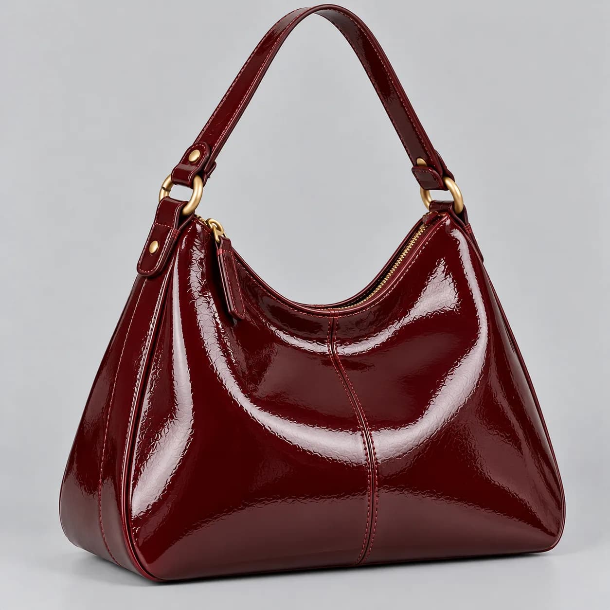 Leather hobo bag product direction on a neutral studio background