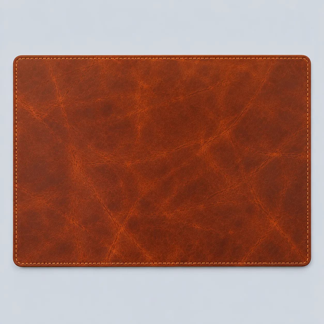 Leather placemat product direction on a neutral studio background
